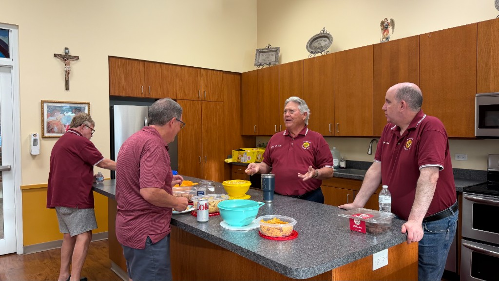 Council members sharing fellowship in the parish kitchen