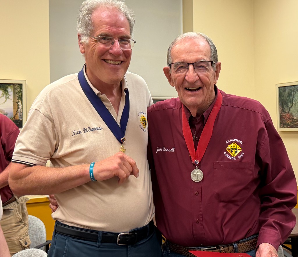 Council officers Nick DiGiovanni and Jim Russell wearing medals